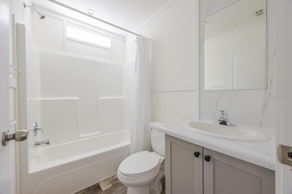 326 Smith Road Polk City, FL 33868 - Photo 10 of 26 a bathroom with a sink a toilet and shower