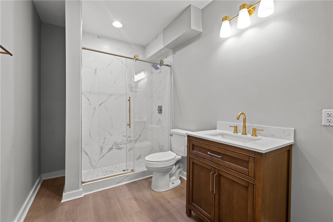 309 Woodland Way Clemson, SC 29631 - Photo 27 of 43 This bathroom features a contemporary vanity and a spacious, glass-enclosed shower with stylish tile work.