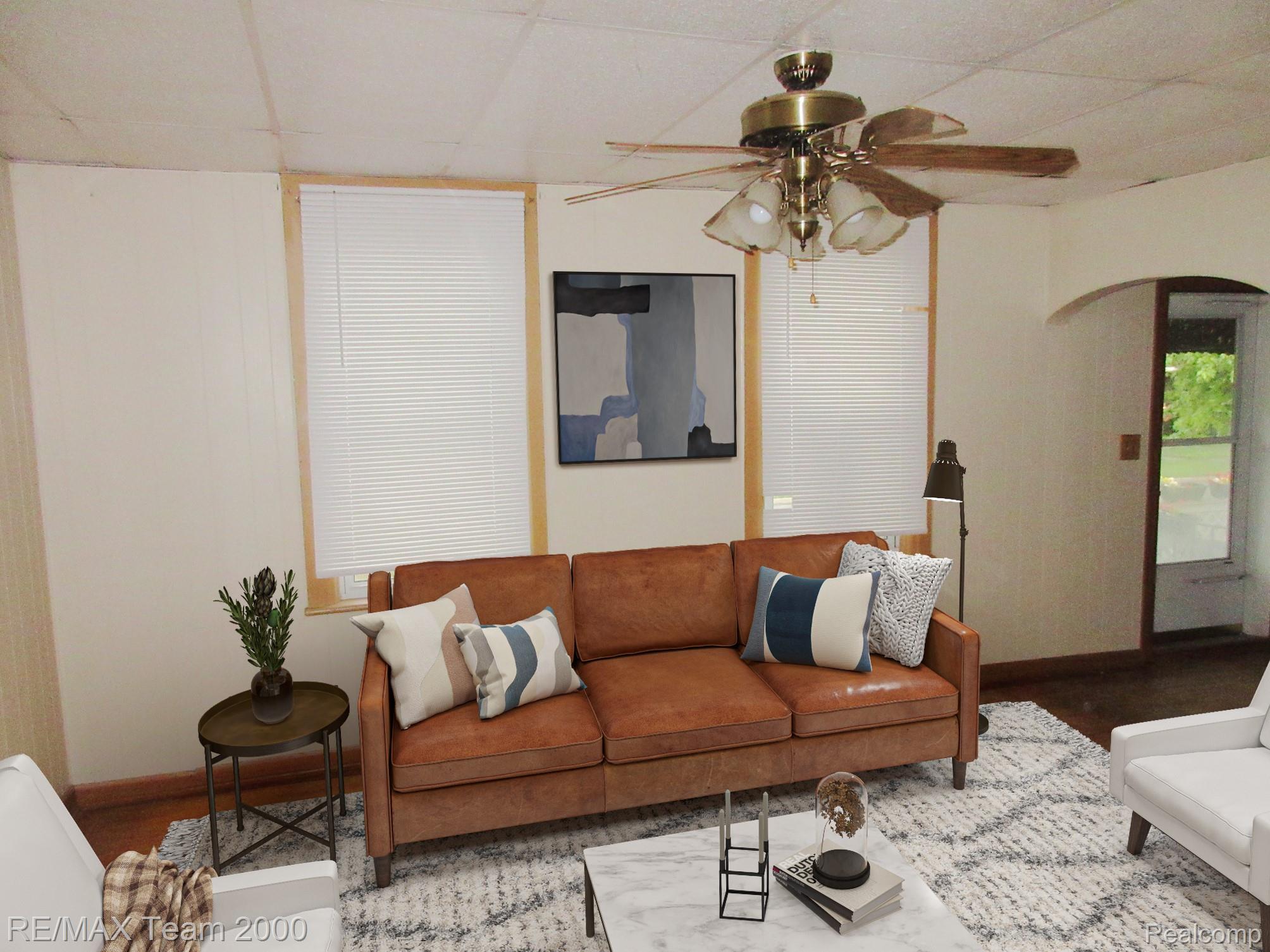 604 Smith Street Monroe, MI 48161 - Photo 4 of 24 Living area featuring light-toned walls, wood-finish flooring, and two windows with blinds