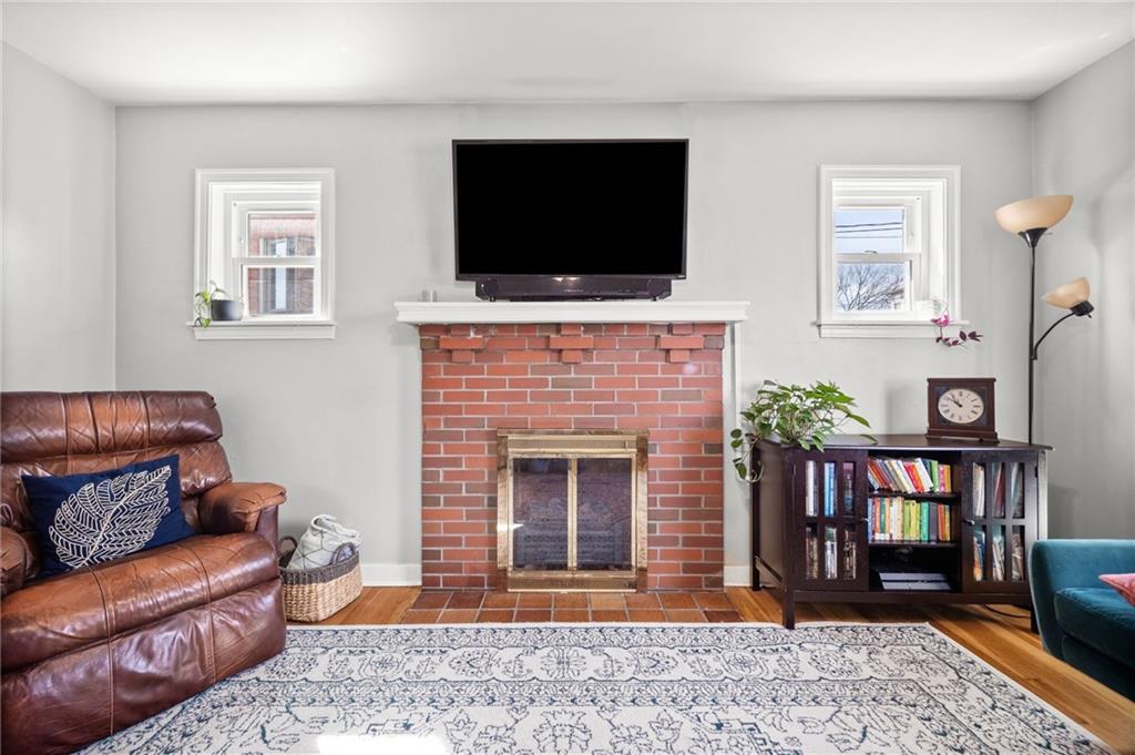 416 Phillips Avenue McKees Rocks, PA 15136 - Photo 7 of 46 a living room with furniture and a flat screen tv