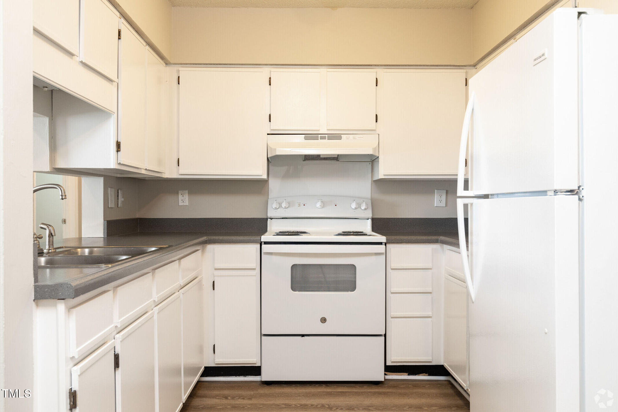 115 Holiday Park Road, Unit 3BED Hillsborough, NC 27278 - Photo 2 of 16 a kitchen with a white cabinets and white appliances