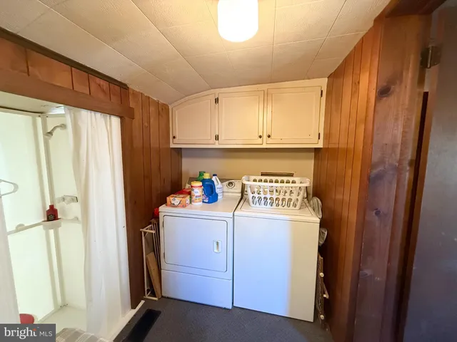 a kitchen with stainless steel appliances a refrigerator and cabinets