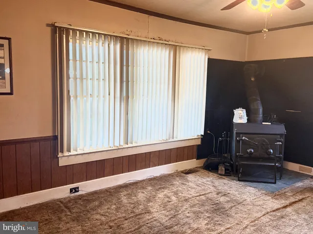 a view of an empty room and a window