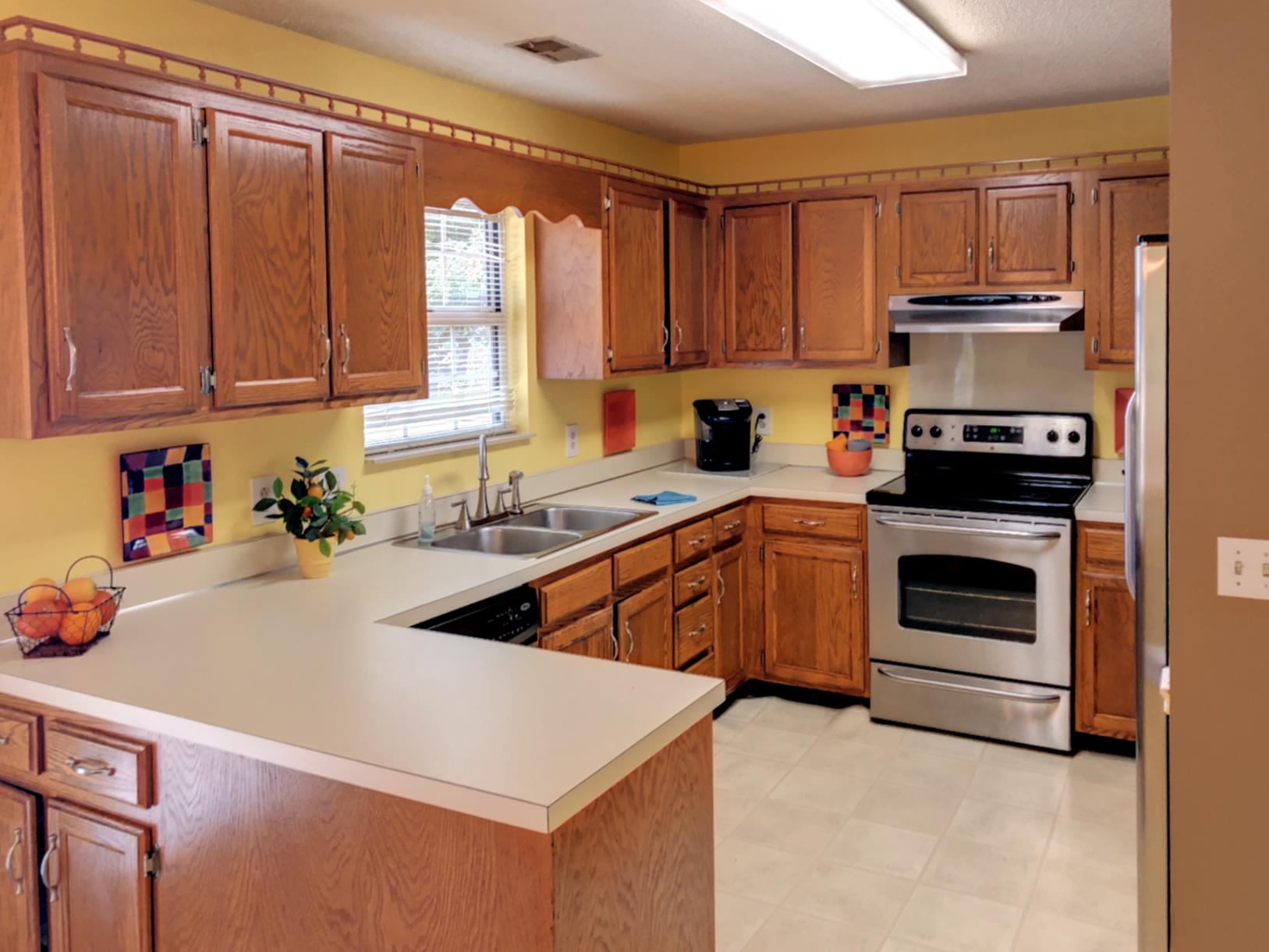 3444 Country Way Road Antioch, TN 37013 - Photo 6 of 19 a kitchen with stainless steel appliances a stove sink and cabinets