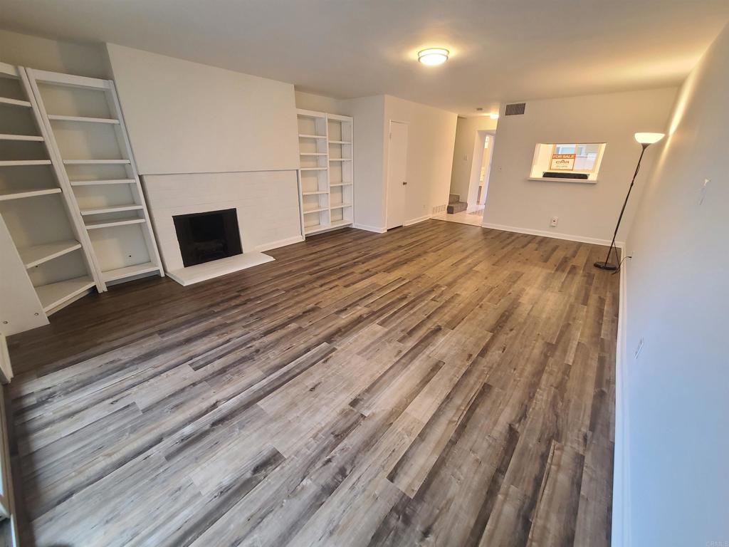 6795 Alvarado Road, Unit 3 San Diego, CA 92120 - Photo 1 of 33 a view of a livingroom with wooden floor
