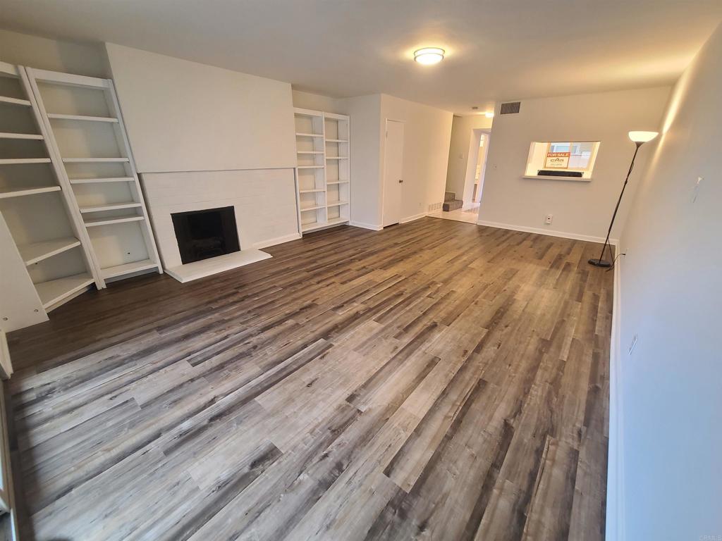 a view of a livingroom with wooden floor