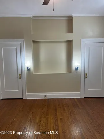 an empty room with wooden floor