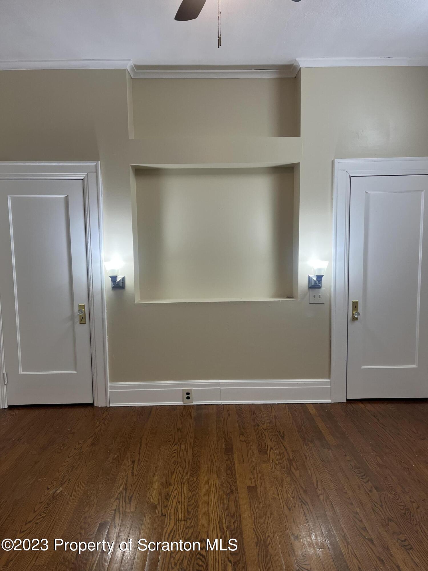 85 Main Street, Unit 1 Dickson City, PA 18447 - Photo 5 of 8 an empty room with wooden floor