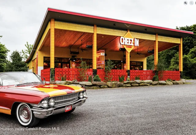 a view of a chairs and table in a balcony