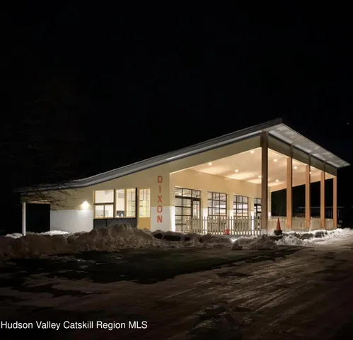 a view of porch with furniture and garden