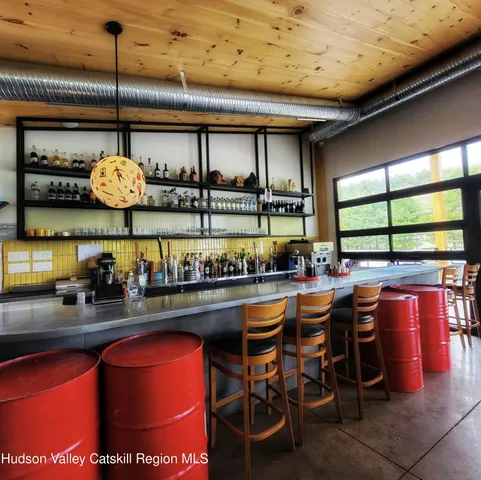 a dining table with chairs and window