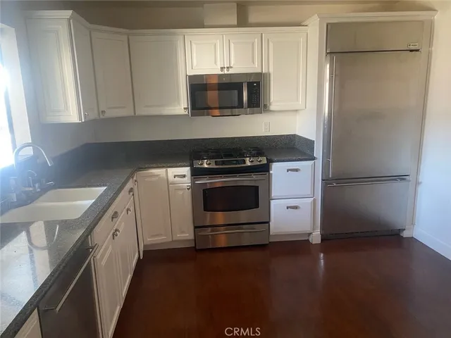 a kitchen with a stove and a microwave