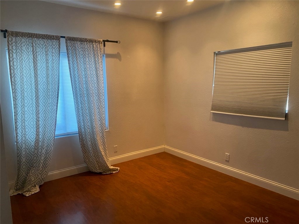 454 Walker Road San Dimas, CA 91773 - Photo 4 of 14 an empty room with a wooden door and door
