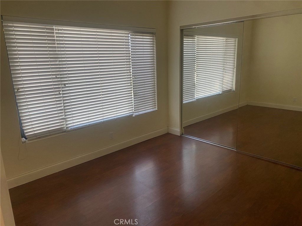 454 Walker Road San Dimas, CA 91773 - Photo 5 of 14 an empty room with wooden floor and windows
