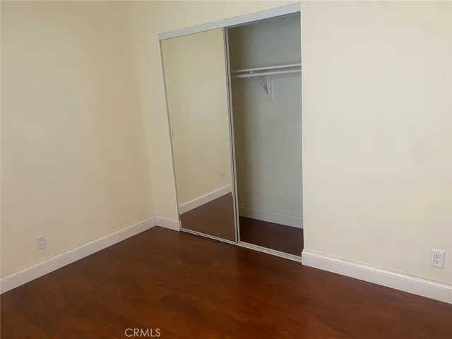 an empty room with wooden floor