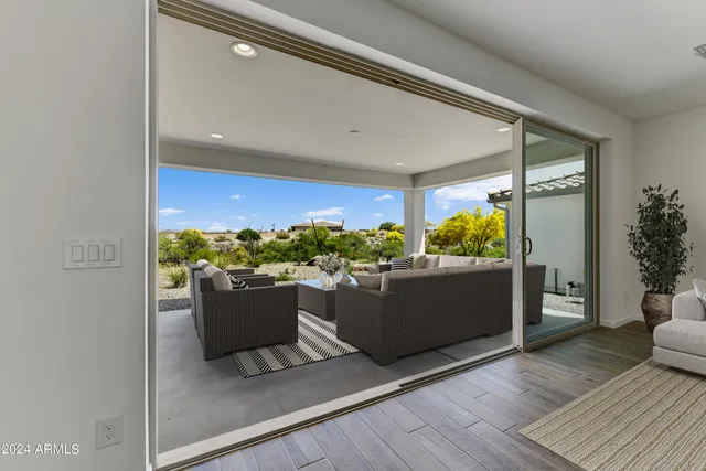 a room with wooden floor and a window