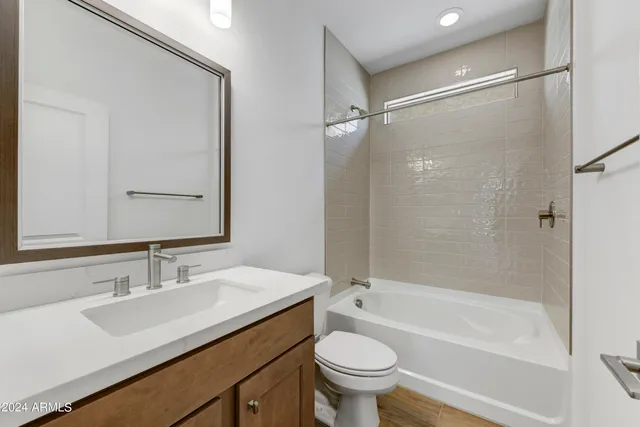 a bathroom with a sink toilet and a bathtub