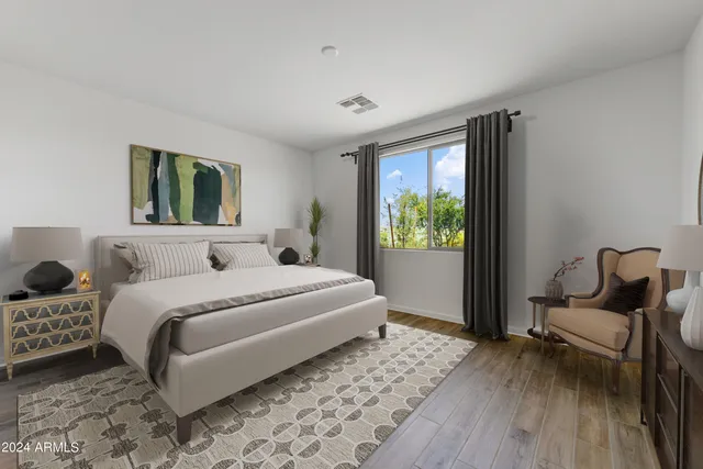 a bedroom with a bed and a window