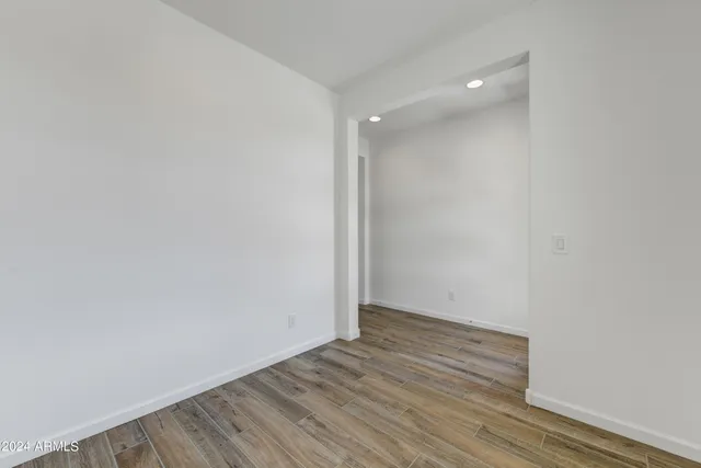 a view of room with wooden floor