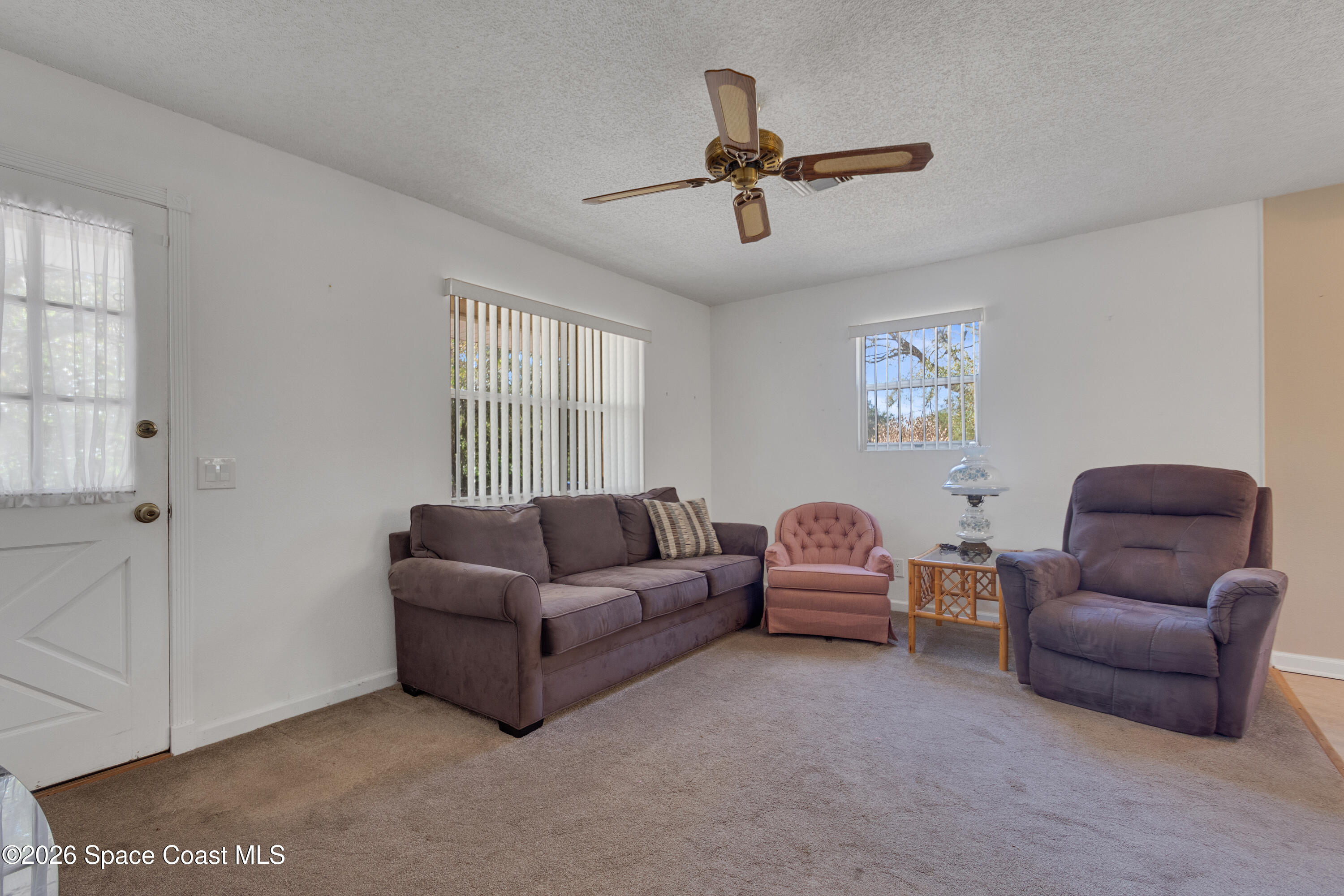 117 Acorn Terrace Sebastian, FL 32958 - Photo 21 of 33 a living room with furniture and a ceiling fan