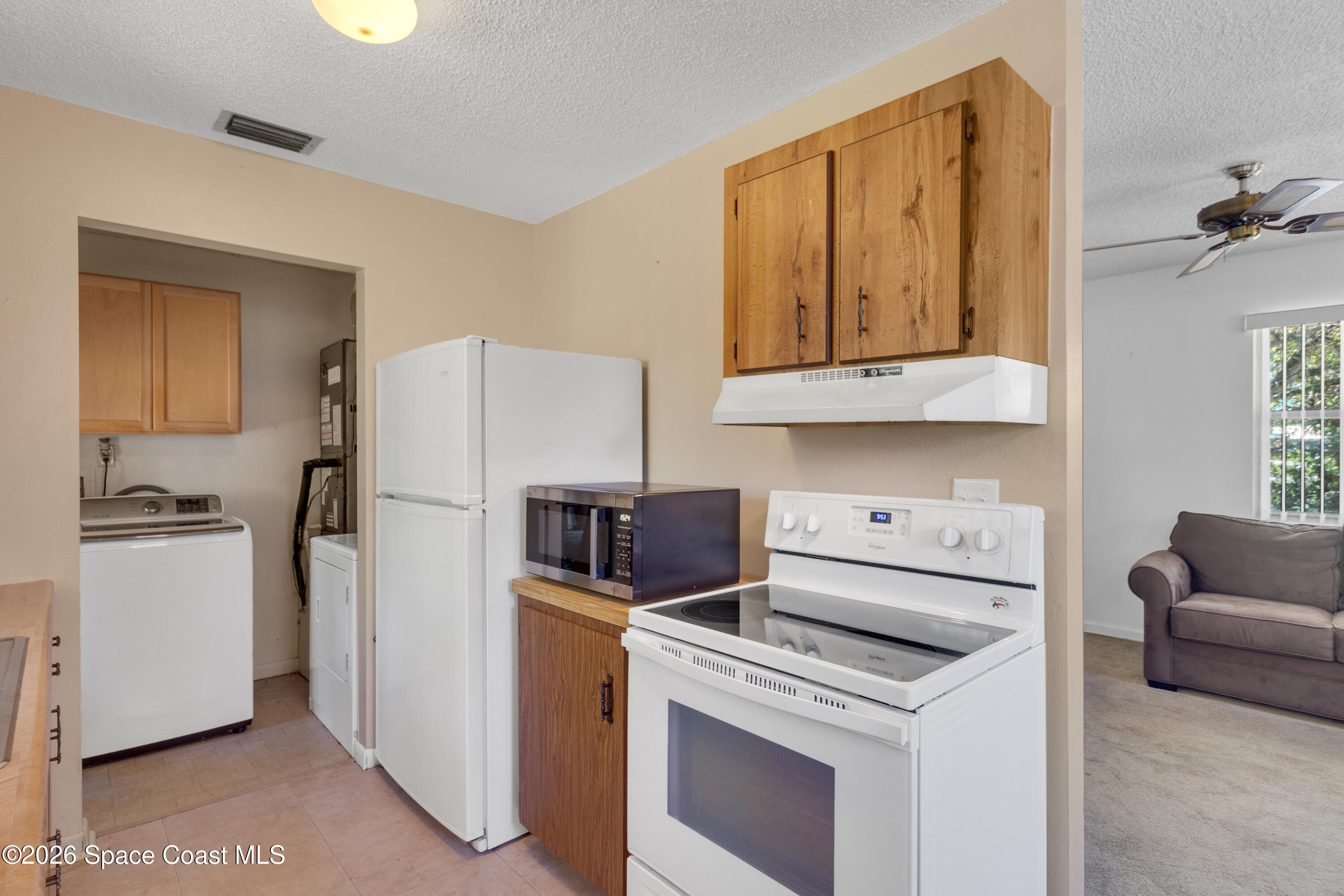 117 Acorn Terrace Sebastian, FL 32958 - Photo 23 of 33 a kitchen with a stove a refrigerator and a sink