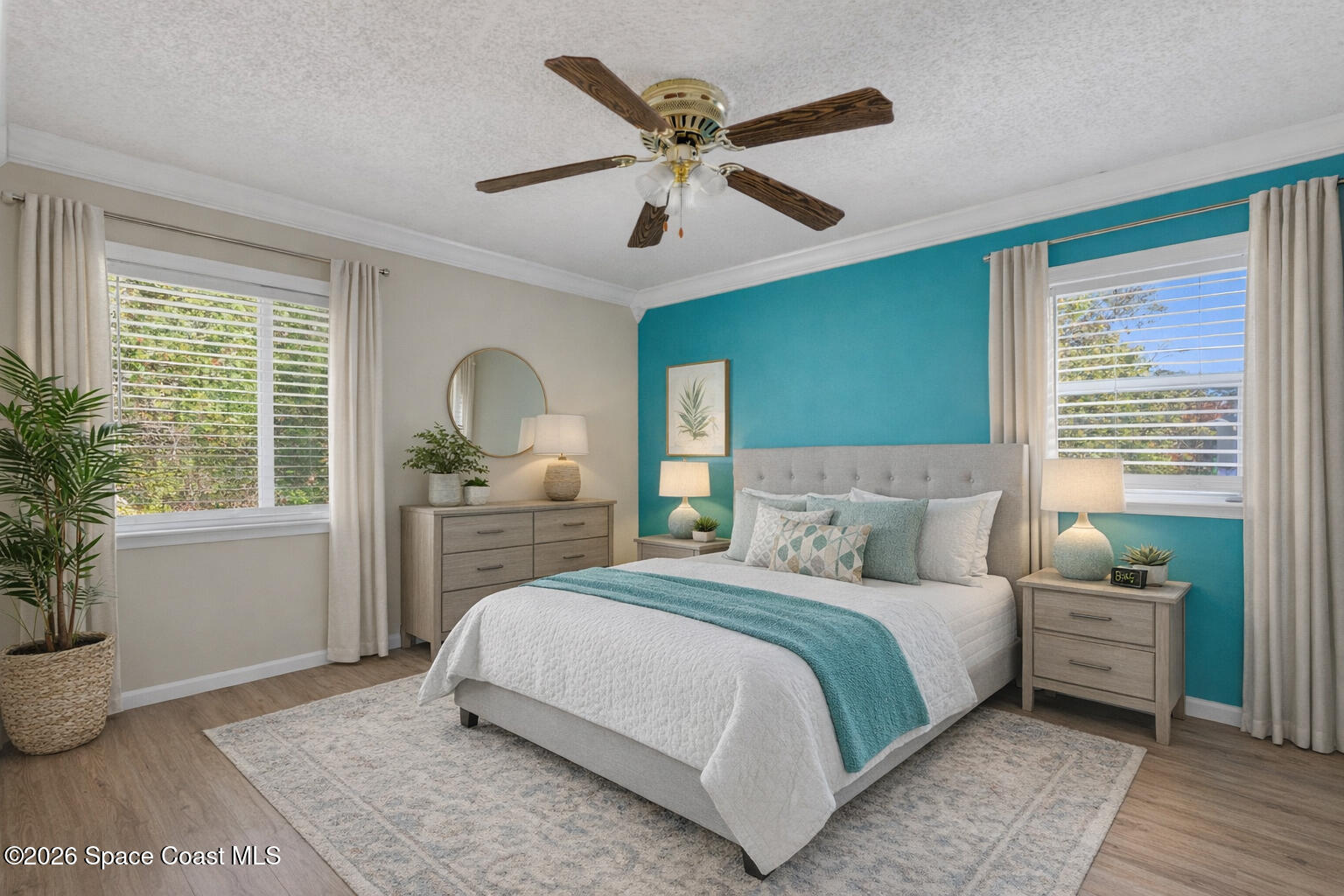 117 Acorn Terrace Sebastian, FL 32958 - Photo 27 of 33 a bedroom with a large bed and a window