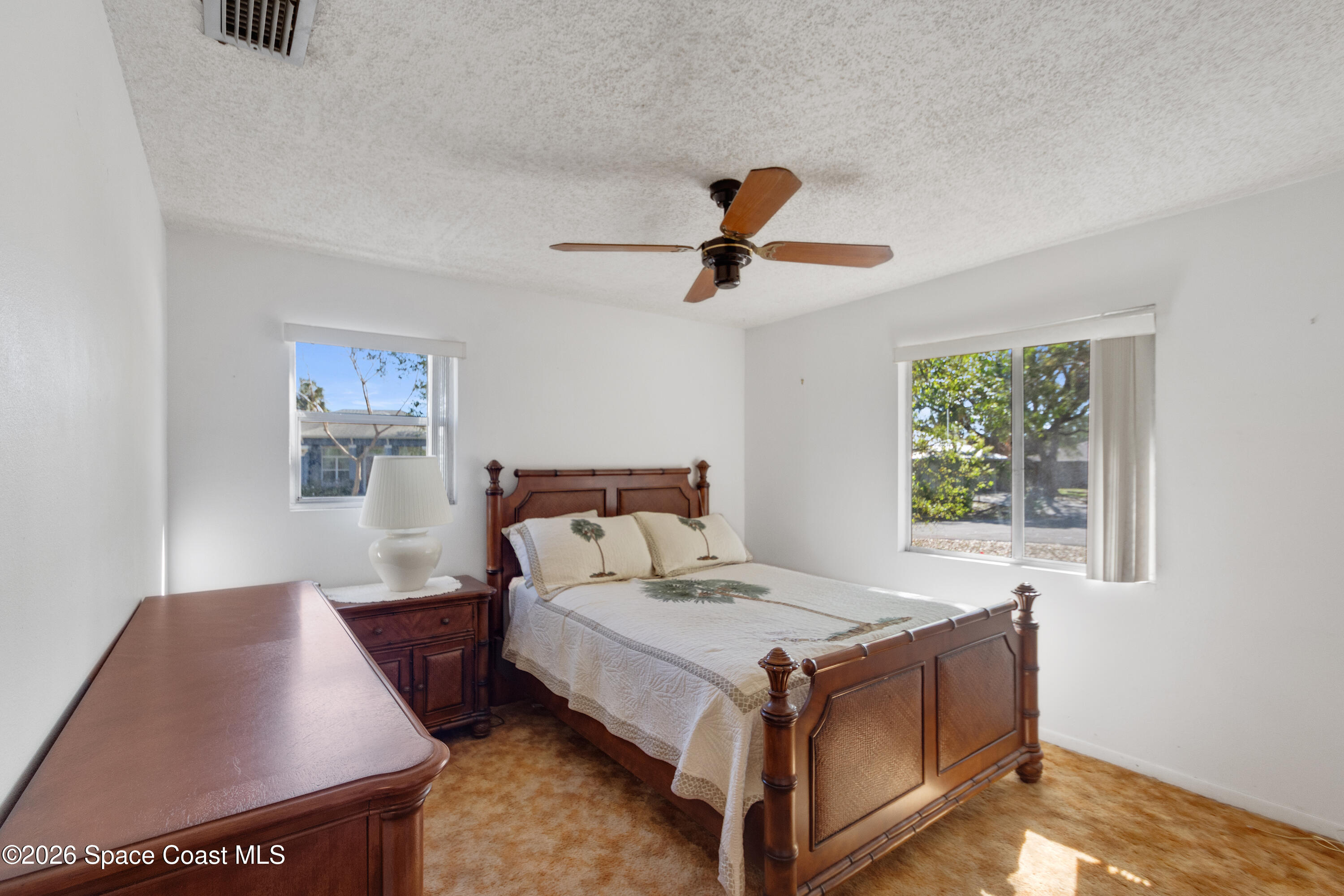117 Acorn Terrace Sebastian, FL 32958 - Photo 30 of 33 a bed room with a bed and a window