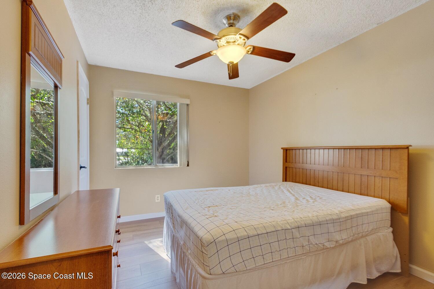 117 Acorn Terrace Sebastian, FL 32958 - Photo 31 of 33 a bedroom with a bed and a large window