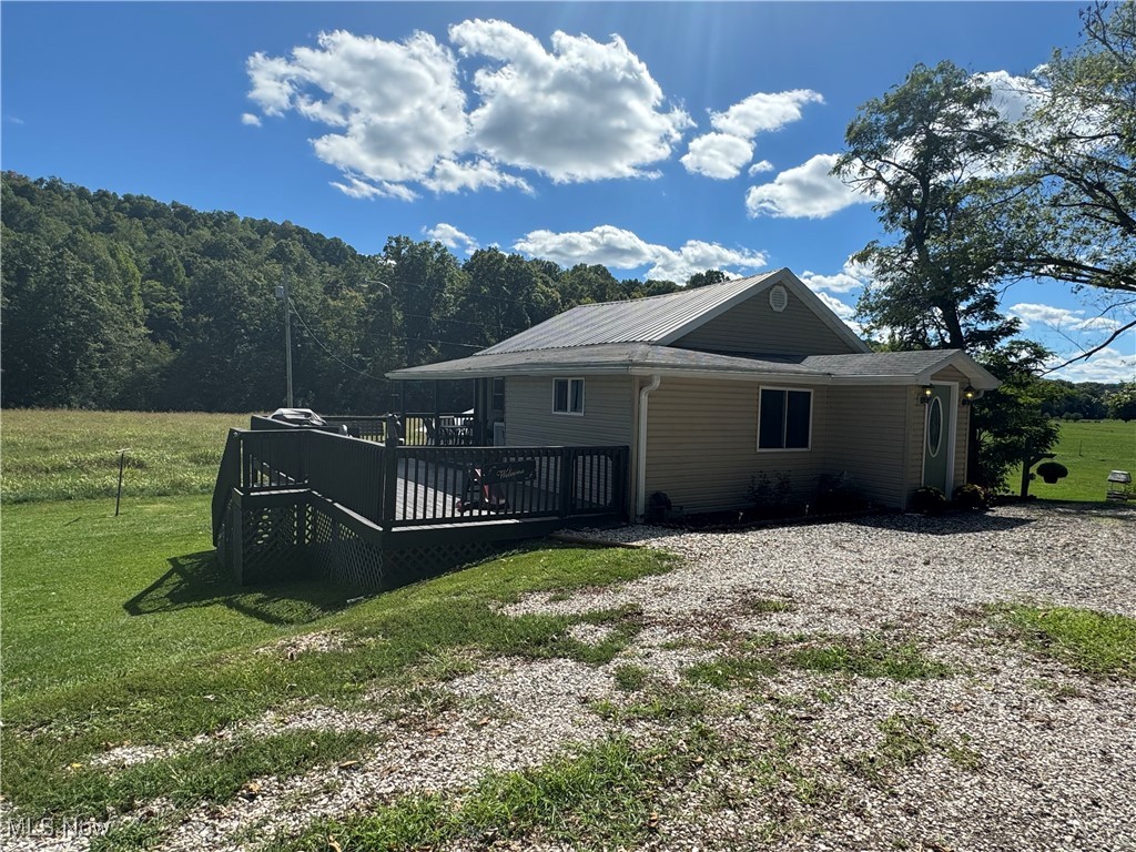 1480 Jerrys Run Road Belleville, WV 26133 - Photo 40 of 48 View of property exterior with a deck and a lawn