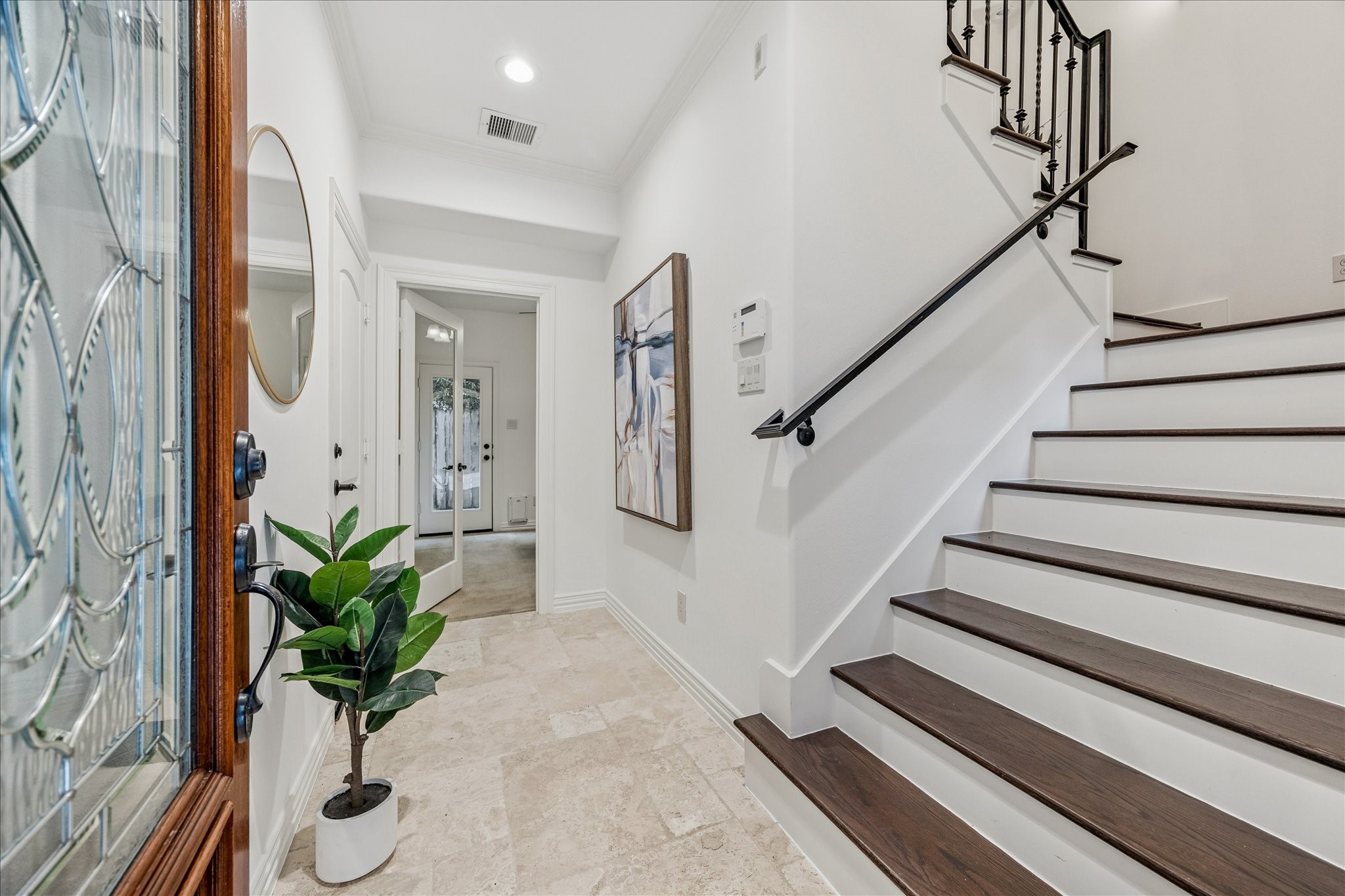 4418 Rose Street Houston, TX 77007 - Photo 2 of 34 a view of staircase with wooden floor and a potted plant