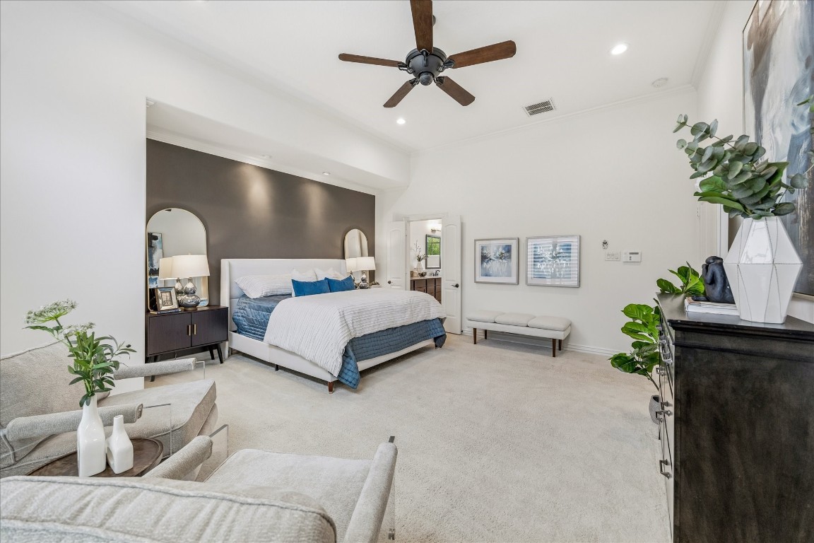 4418 Rose Street Houston, TX 77007 - Photo 20 of 34 Light filled primary bedroom featuring fresh interior paint, a stylish accent wall, recessed lighting, and a comfortable sitting area.