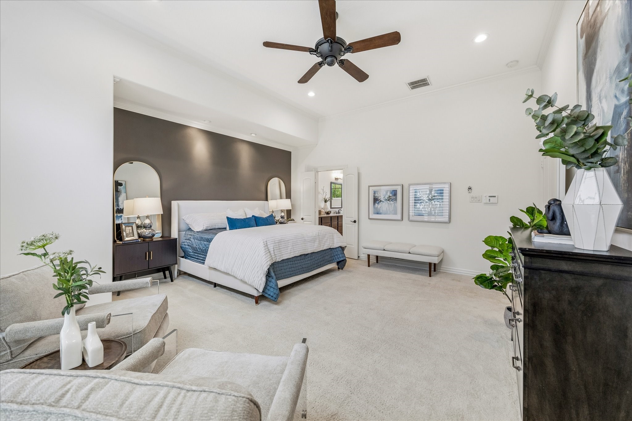 4418 Rose Street Houston, TX 77007 - Photo 20 of 34 Light filled primary bedroom featuring fresh interior paint, a stylish accent wall, recessed lighting, and a comfortable sitting area.