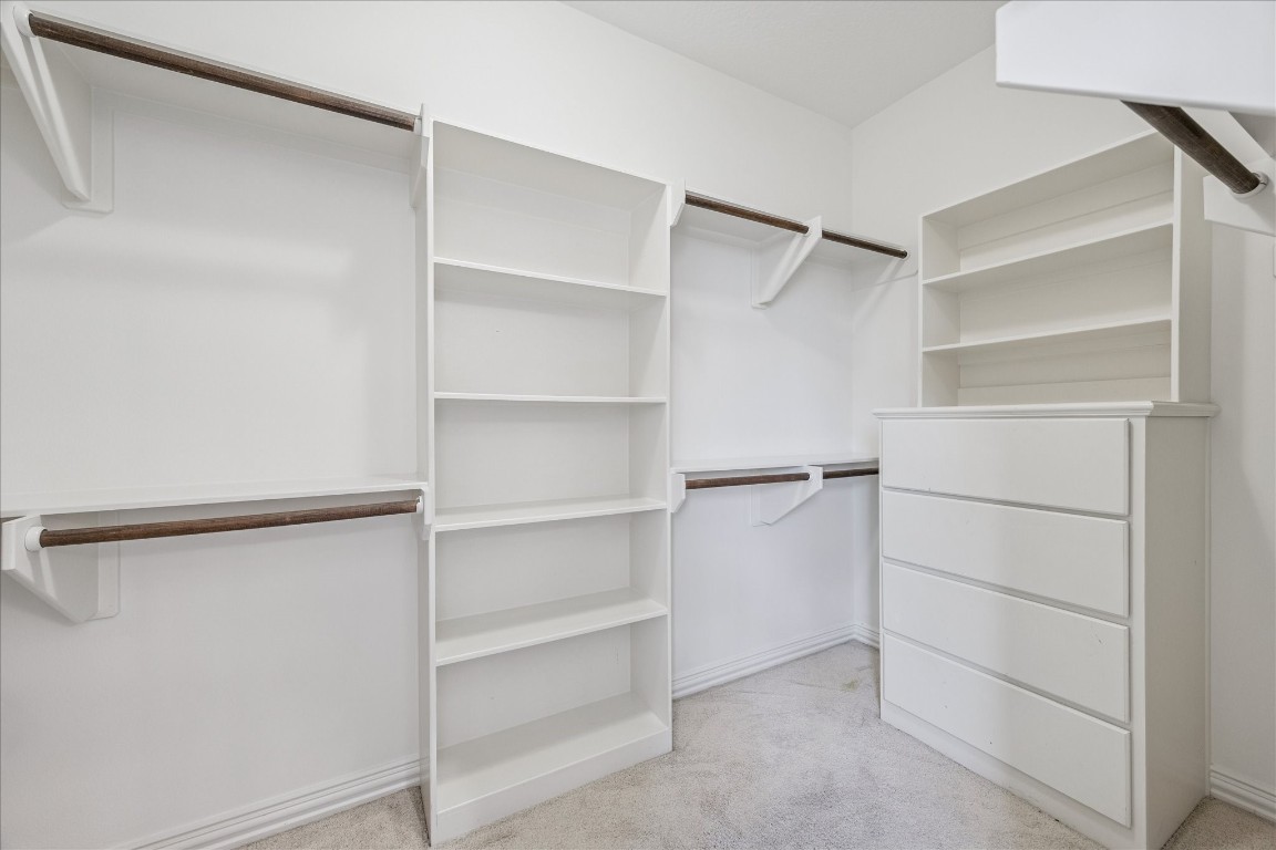 4418 Rose Street Houston, TX 77007 - Photo 23 of 34 Additional walk in closet located within the primary bathroom, providing convenient storage with built in shelving.