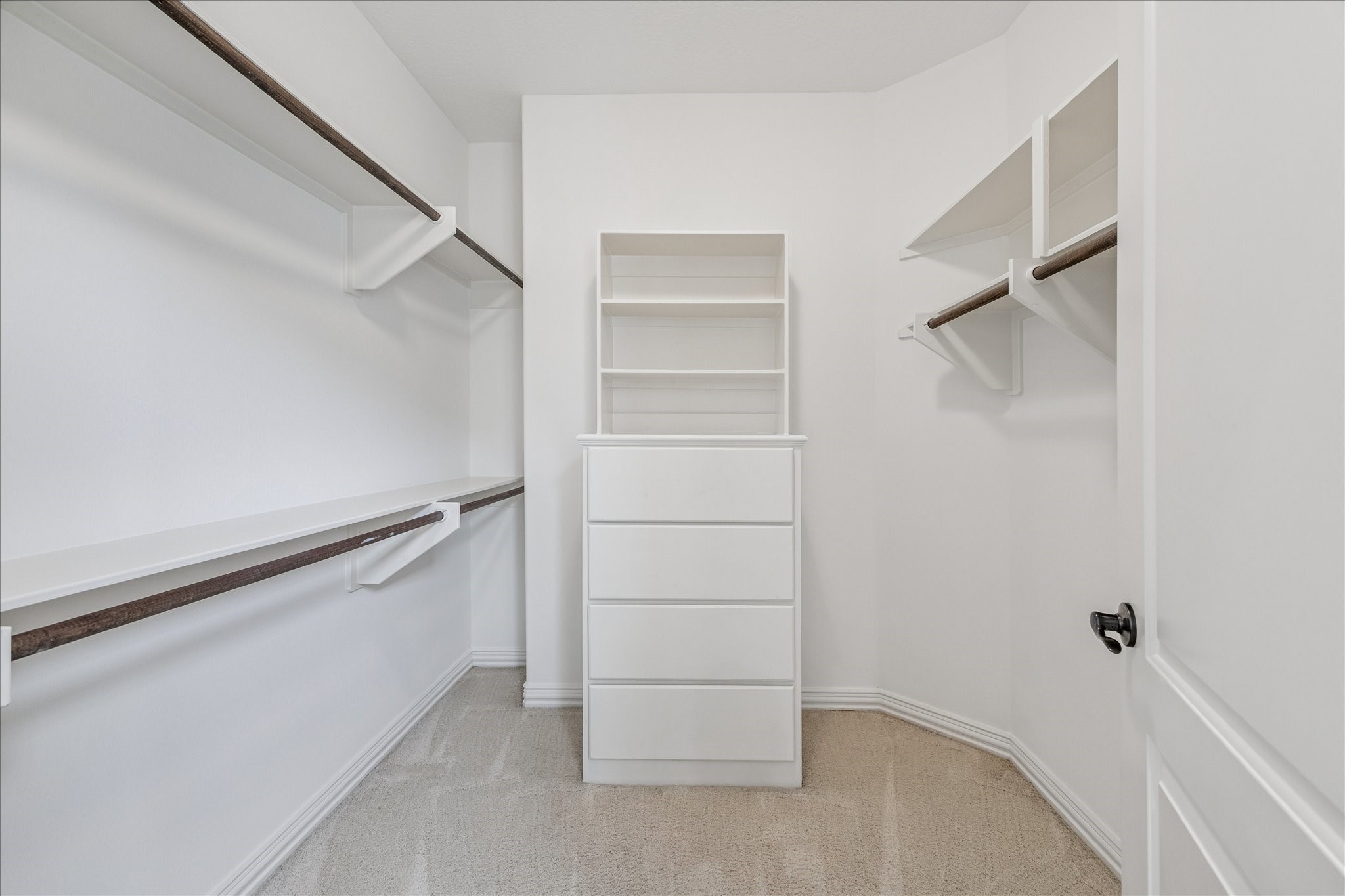 4418 Rose Street Houston, TX 77007 - Photo 24 of 34 Primary suite walk in closet located in the bedroom, offering generous space with built in upper and lower storage.