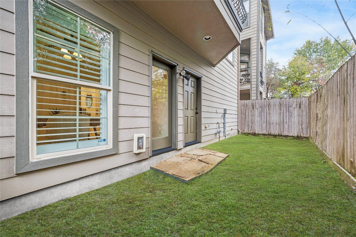 4418 Rose Street Houston, TX 77007 - Photo 5 of 34 Private ground level patio with fenced yard space, offering a rare outdoor area ideal for pets, gardening, or everyday outdoor use.