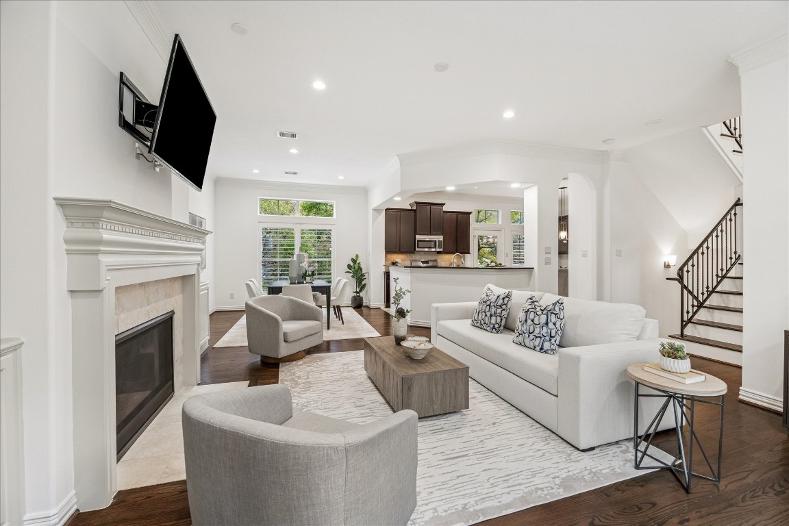 4418 Rose Street Houston, TX 77007 - Photo 6 of 34 a living room with furniture a fireplace and a flat screen tv