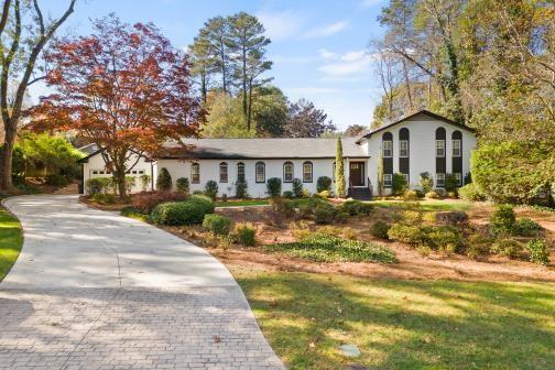 5700 Eden Roc Lane Sandy Springs, GA 30342 - Photo 1 of 1 a front view of a house with a yard