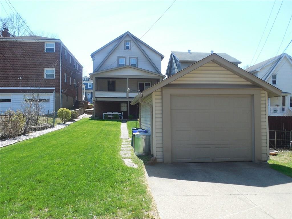 1435 Ridge Avenue Coraopolis, PA 15108 - Photo 3 of 24 Just steps from the home is its single car detached garage with room for additional parking.