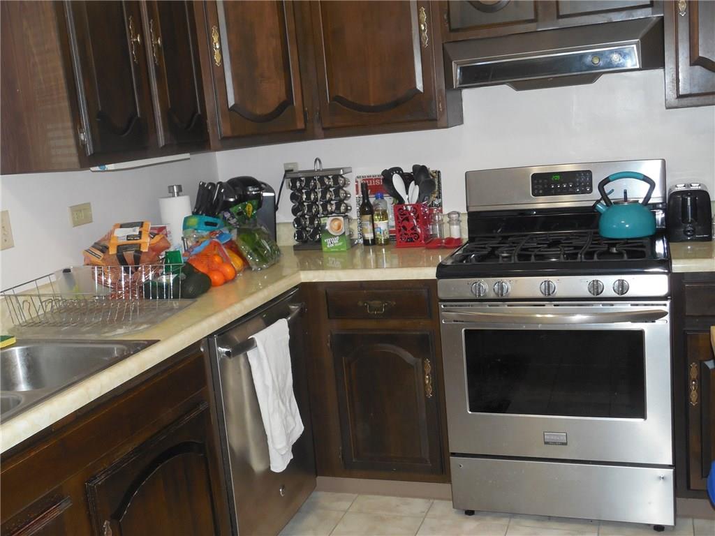 1435 Ridge Avenue Coraopolis, PA 15108 - Photo 8 of 24 A comfy kitcen with ample space for preparation includes stainless steel convection over, dishwasher...