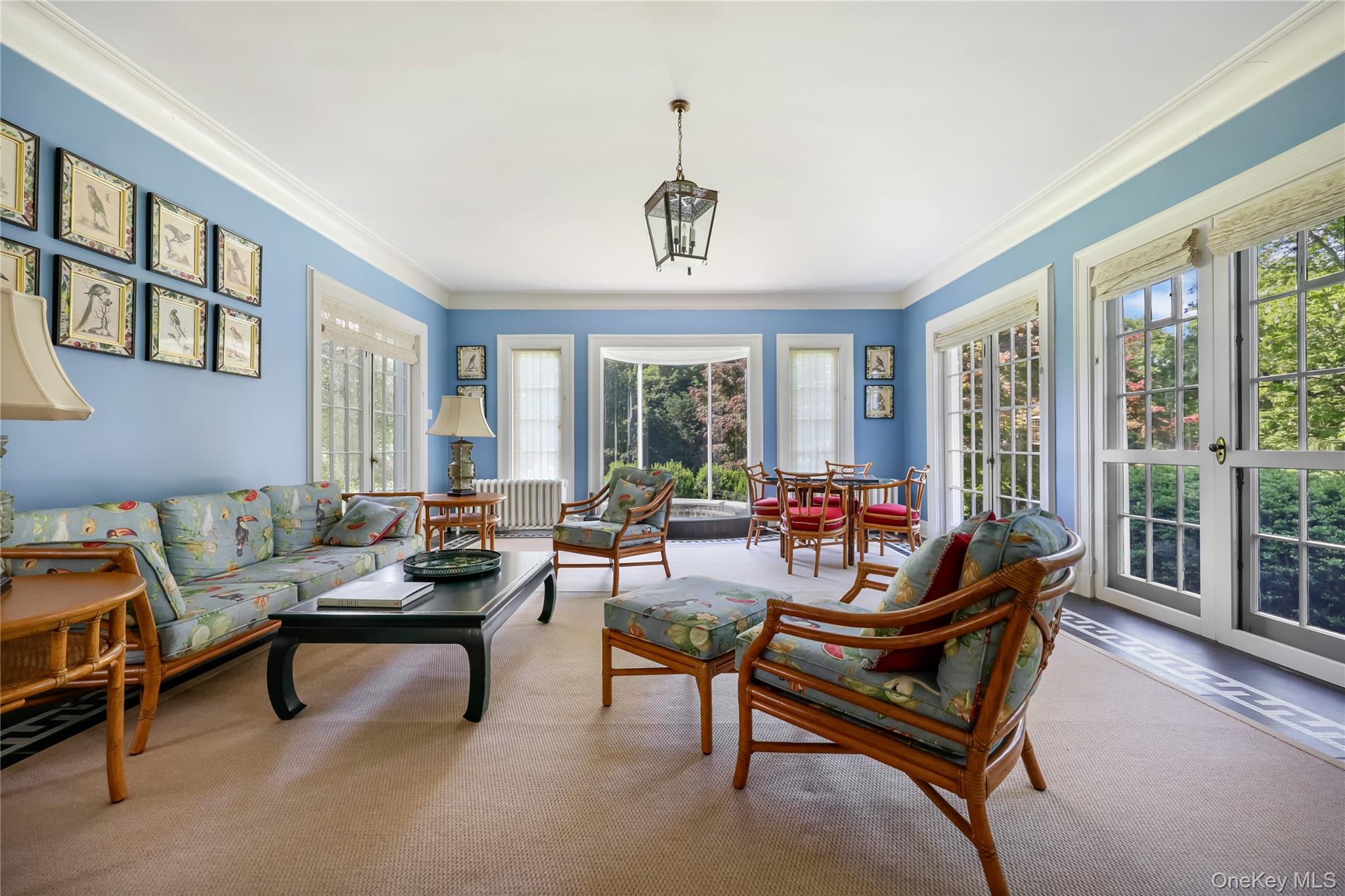 36 Revolutionary Road Briarcliff Manor, NY 10510 - Photo 13 of 50 Living area featuring plenty of natural light, ornamental molding, and carpet floors