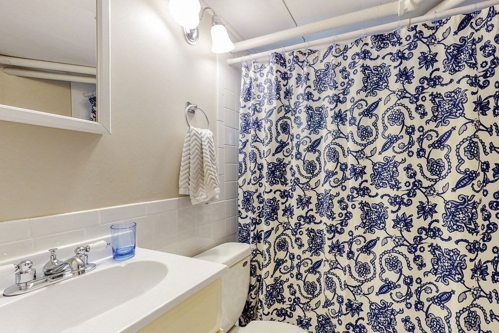 15 Sunset Road, Unit 15 Watertown, MA 02472 - Photo 17 of 22 a bathroom with a sink toilet and shower