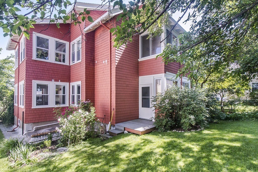 15 Sunset Road, Unit 15 Watertown, MA 02472 - Photo 20 of 22 a view of a house with a yard and plants