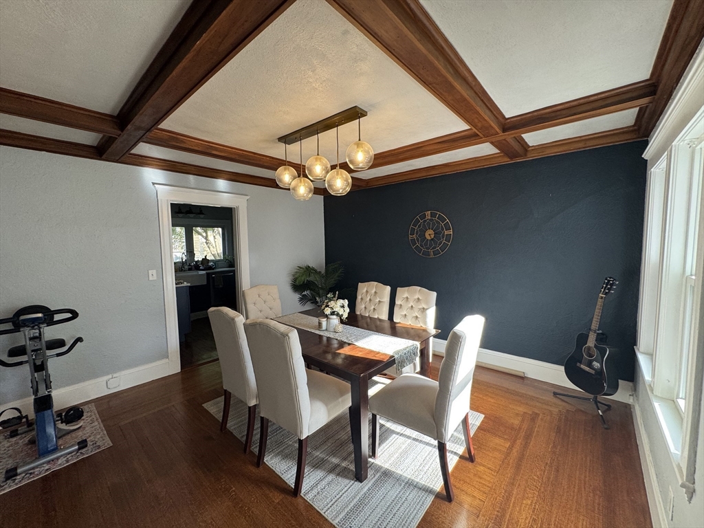 15 Sunset Road, Unit 15 Watertown, MA 02472 - Photo 3 of 22 a view of a dining room with furniture and wooden floor