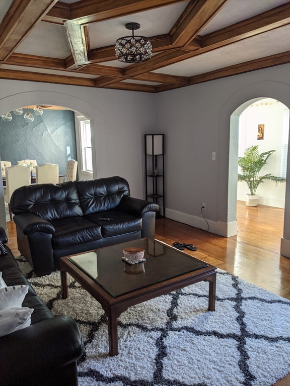 15 Sunset Road, Unit 15 Watertown, MA 02472 - Photo 5 of 22 a living room with furniture a rug and a window