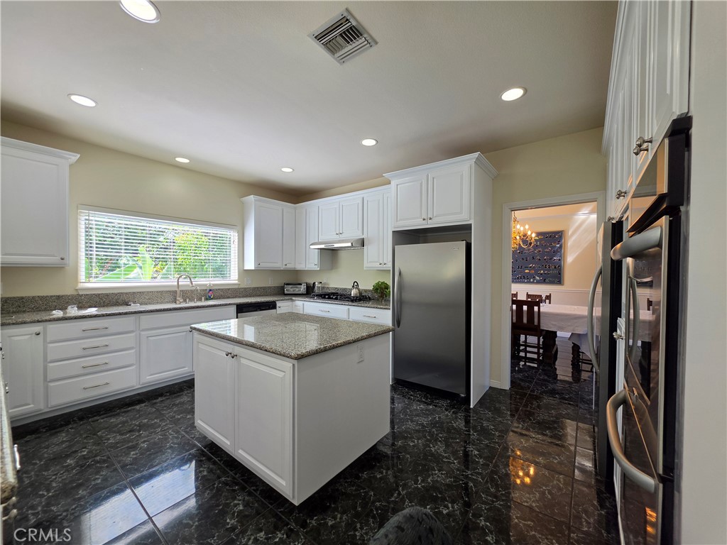 11541 Donovan Road Rossmoor, CA 90720 - Photo 38 of 113 Refreshed kitchen with separate counter depth refrigerator and freezer and double wall convection oven
