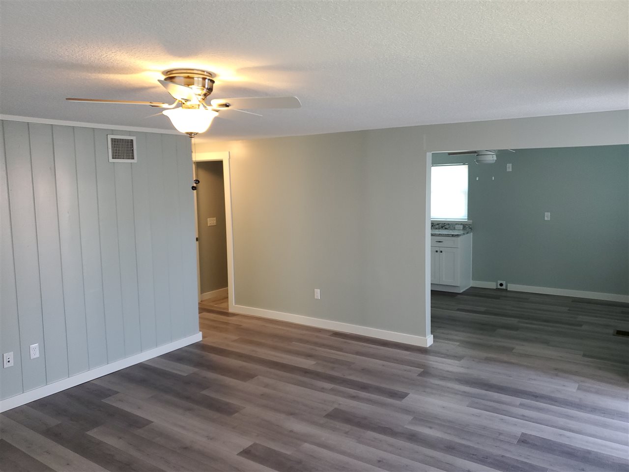 105 Beachcomber Way, Unit B St. Augustine, FL 32084 - Photo 14 of 14 wooden floor in an empty room with a window