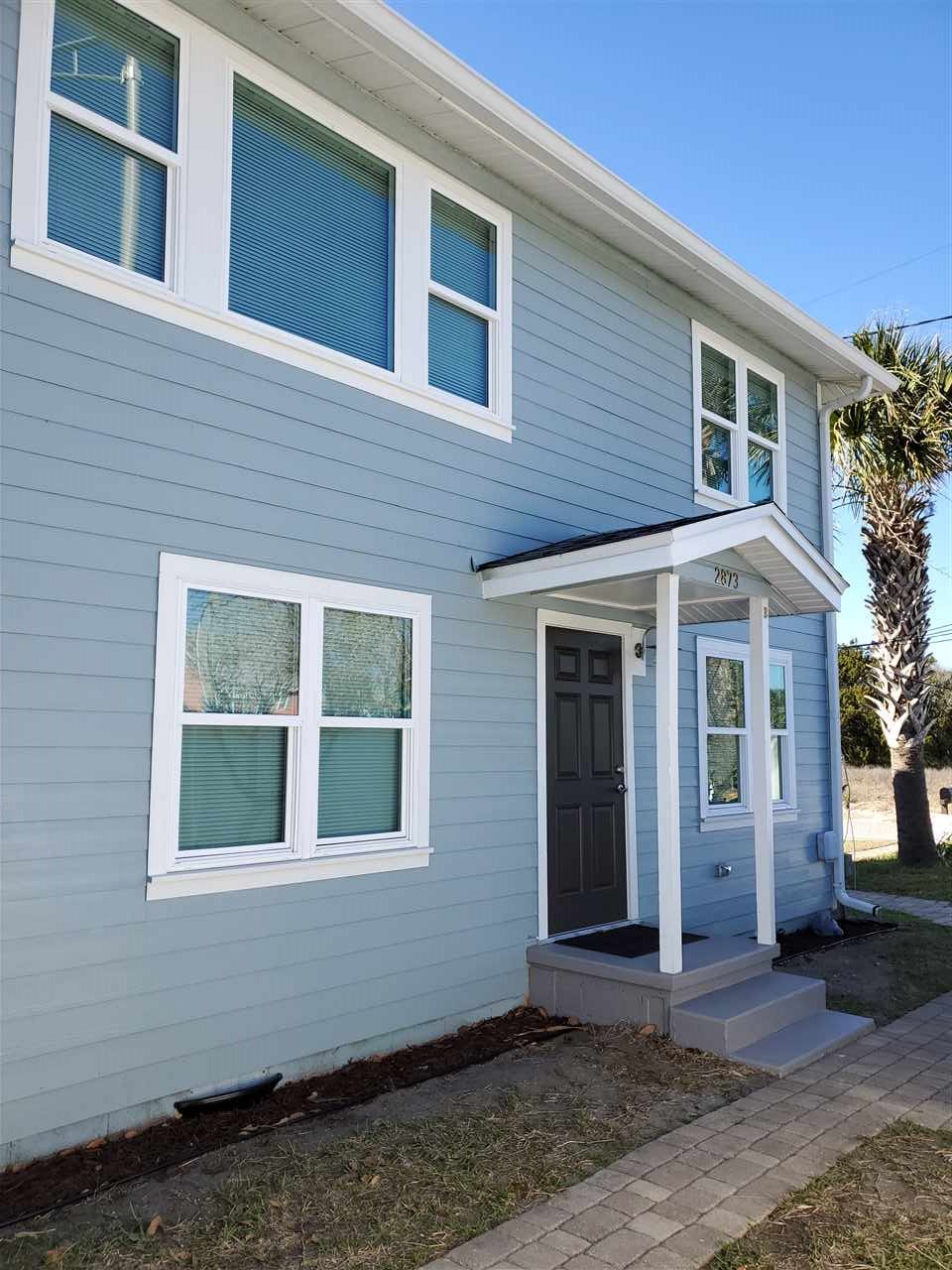 105 Beachcomber Way, Unit B St. Augustine, FL 32084 - Photo 2 of 14 a front view of a house