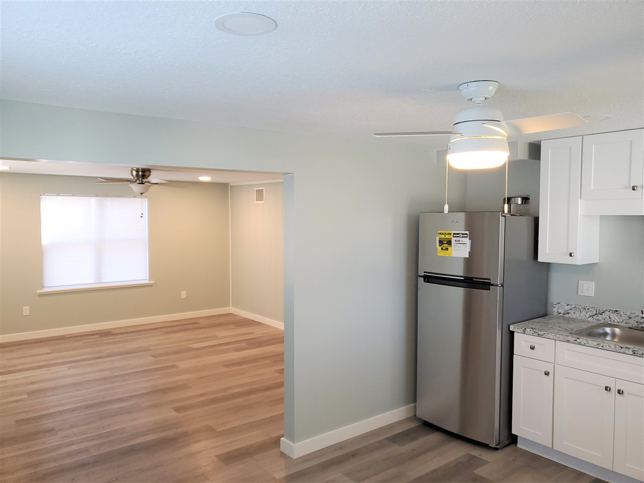 105 Beachcomber Way, Unit B St. Augustine, FL 32084 - Photo 6 of 14 a view of a kitchen cabinets and wooden floor