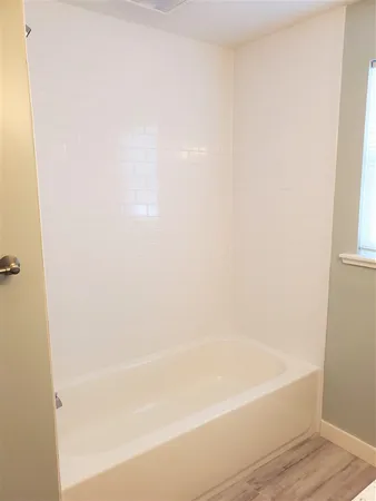a close up of a bathtub in a bathroom