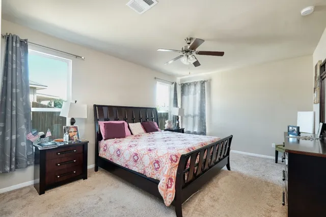 a bedroom with a bed and a mirror